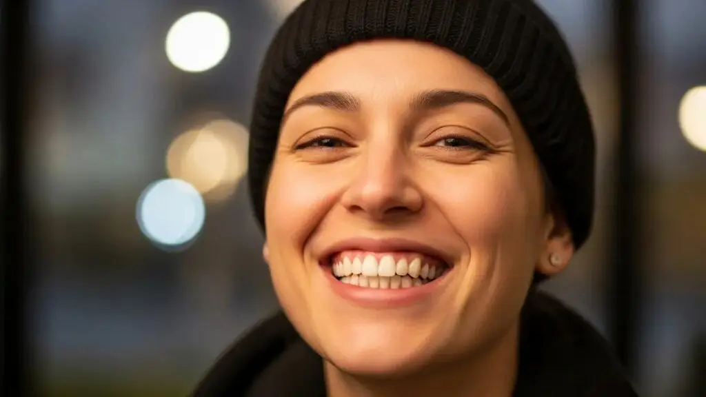 Smiling person with full mouth dental implants showcasing confidence and natural appearance
